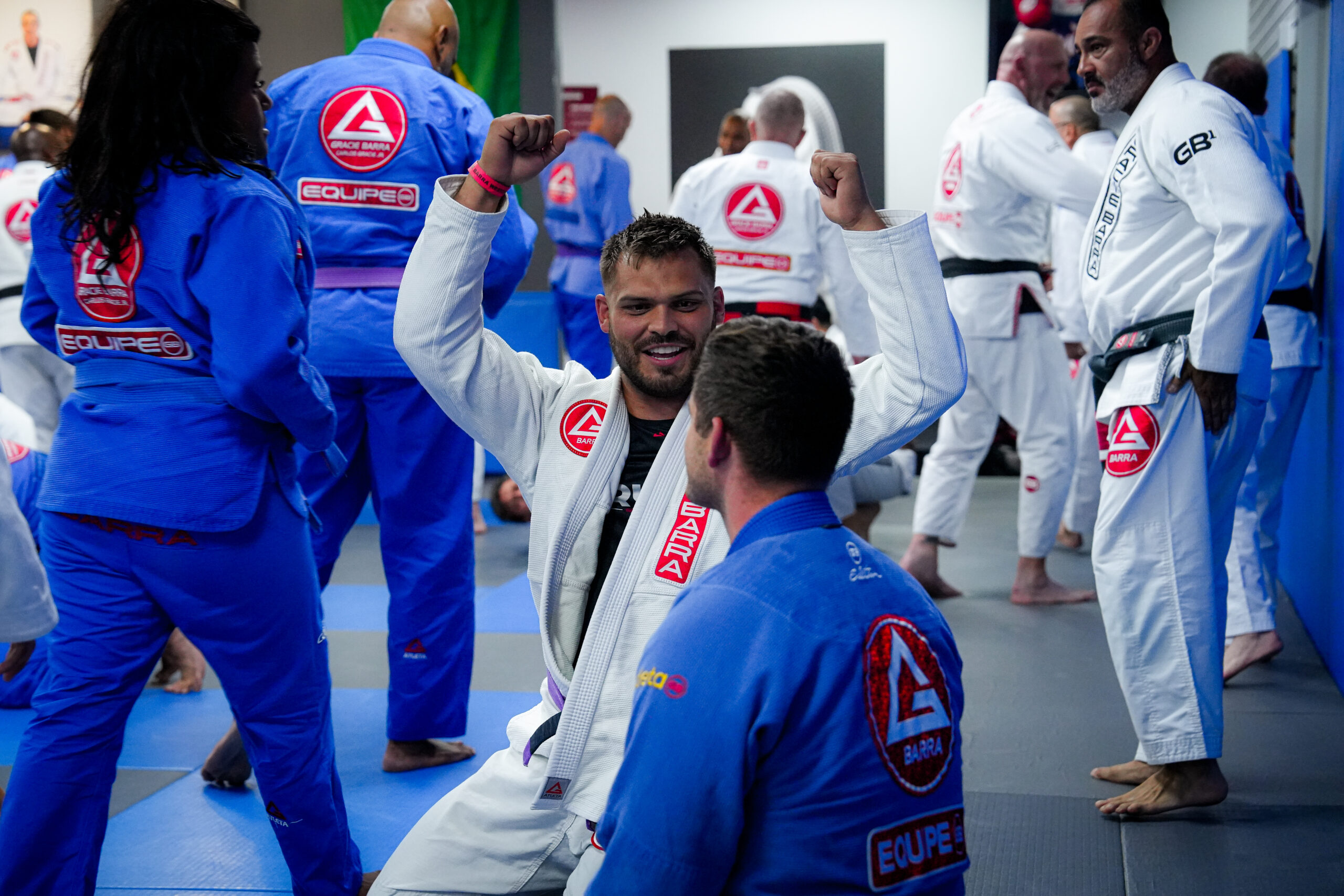 Adult Gi jiu-jitsu training partners practicing at Gracie Barra Westchase